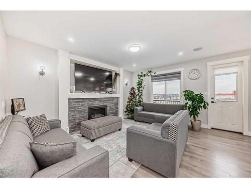 92 Saddlecrest Link Ne, Calgary, AB - Indoor Photo Showing Living Room With Fireplace