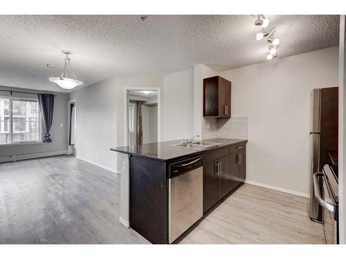 1335-81 Legacy Boulevard Se, Calgary, AB - Indoor Photo Showing Kitchen With Double Sink