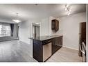 1335-81 Legacy Boulevard Se, Calgary, AB  - Indoor Photo Showing Kitchen With Double Sink 