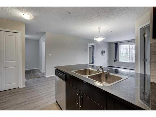 1335-81 Legacy Boulevard Se, Calgary, AB - Indoor Photo Showing Kitchen With Double Sink