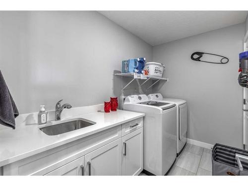 132 Sunrise Common, Cochrane, AB - Indoor Photo Showing Laundry Room