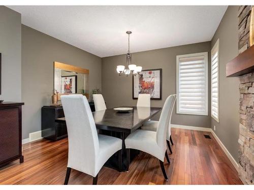 111 Cranleigh Terrace Se, Calgary, AB - Indoor Photo Showing Dining Room With Fireplace