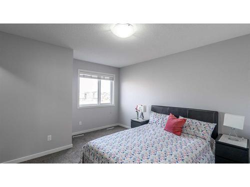 303-70 Saddlestone Drive Ne, Calgary, AB - Indoor Photo Showing Bedroom