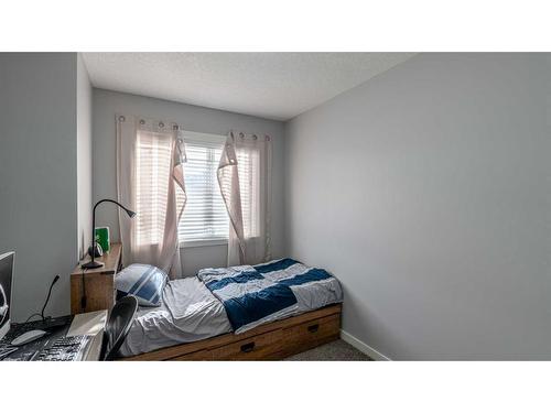 303-70 Saddlestone Drive Ne, Calgary, AB - Indoor Photo Showing Bedroom