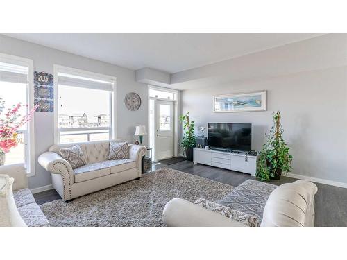 303-70 Saddlestone Drive Ne, Calgary, AB - Indoor Photo Showing Living Room