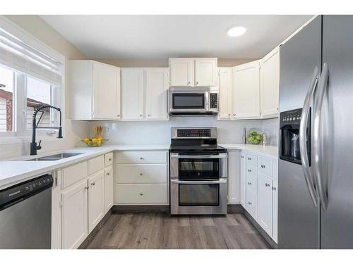 543 Summerwood Place Se, Airdrie, AB - Indoor Photo Showing Kitchen With Double Sink