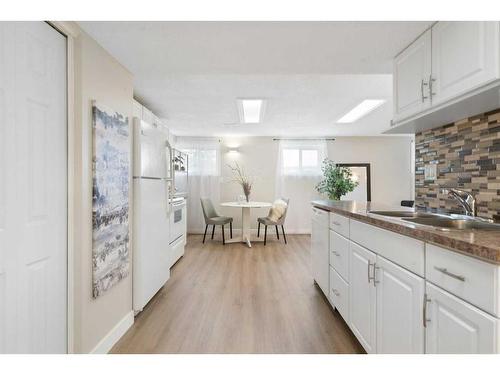 543 Summerwood Place Se, Airdrie, AB - Indoor Photo Showing Kitchen With Double Sink