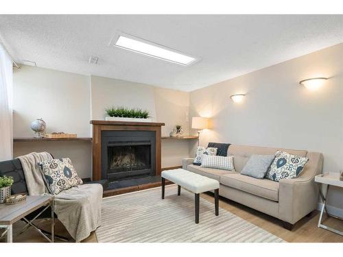 543 Summerwood Place Se, Airdrie, AB - Indoor Photo Showing Living Room With Fireplace