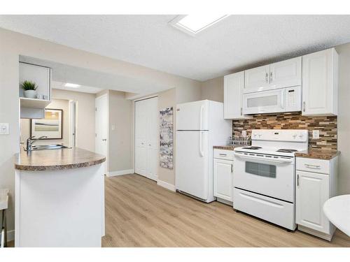 543 Summerwood Place Se, Airdrie, AB - Indoor Photo Showing Kitchen With Double Sink