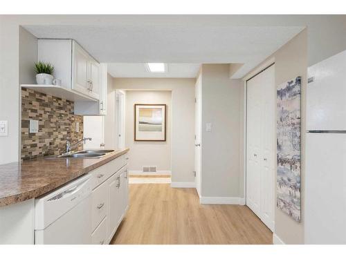 543 Summerwood Place Se, Airdrie, AB - Indoor Photo Showing Kitchen With Double Sink