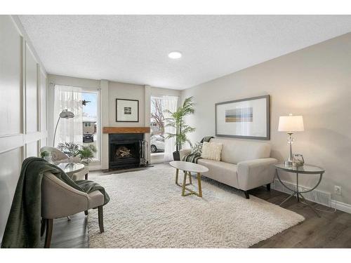 543 Summerwood Place Se, Airdrie, AB - Indoor Photo Showing Living Room With Fireplace