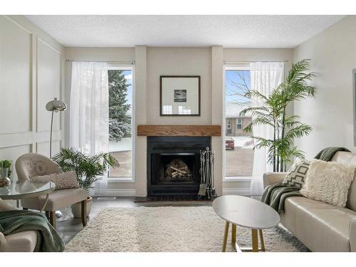 543 Summerwood Place Se, Airdrie, AB - Indoor Photo Showing Living Room With Fireplace