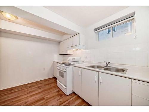 103 Hawktree Close Nw, Calgary, AB - Indoor Photo Showing Kitchen With Double Sink