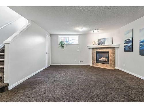 68 Auburn Bay Crescent Se, Calgary, AB - Indoor Photo Showing Other Room With Fireplace