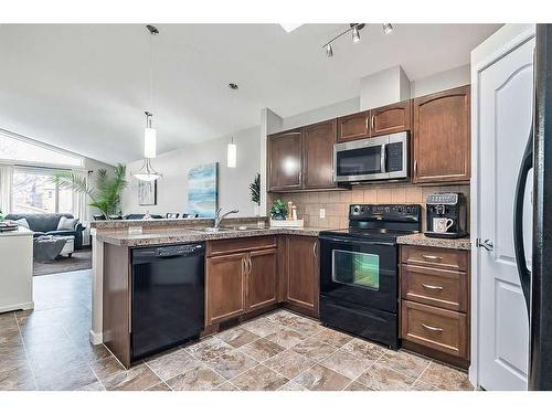 68 Auburn Bay Crescent Se, Calgary, AB - Indoor Photo Showing Kitchen With Double Sink