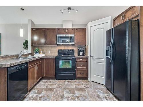 68 Auburn Bay Crescent Se, Calgary, AB - Indoor Photo Showing Kitchen With Double Sink