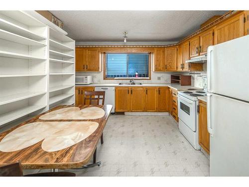 103 Sandstone Way Nw, Calgary, AB - Indoor Photo Showing Kitchen With Double Sink