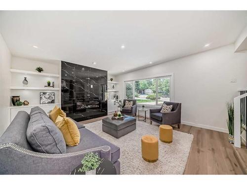 128 Cantrell Place Sw, Calgary, AB - Indoor Photo Showing Living Room With Fireplace