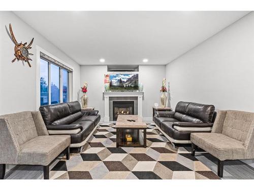 235 California Place Ne, Calgary, AB - Indoor Photo Showing Living Room With Fireplace