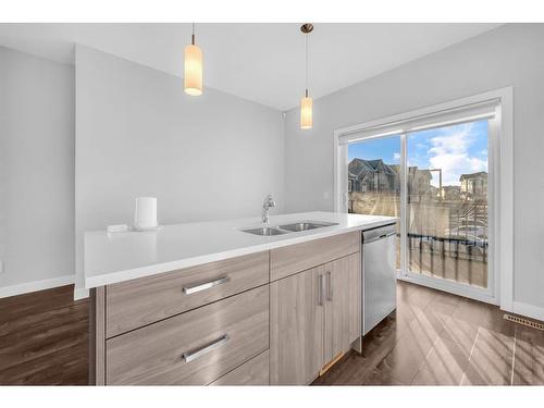 450 Canals Crossing Sw, Airdrie, AB - Indoor Photo Showing Kitchen With Double Sink