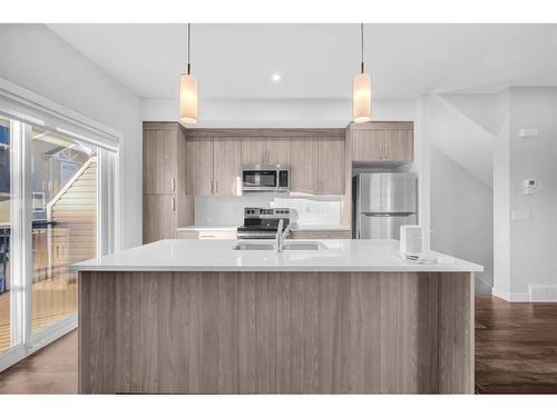 450 Canals Crossing Sw, Airdrie, AB - Indoor Photo Showing Kitchen With Upgraded Kitchen