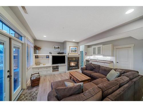 15 Sterling Springs Crescent, Rural Rocky View County, AB - Indoor Photo Showing Living Room With Fireplace