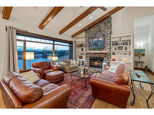 15 Sterling Springs Crescent, Rural Rocky View County, AB - Indoor Photo Showing Living Room With Fireplace