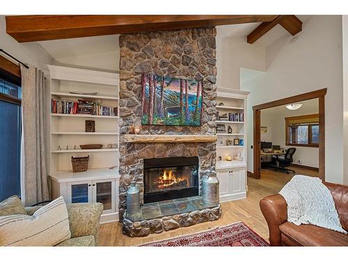 15 Sterling Springs Crescent, Rural Rocky View County, AB - Indoor Photo Showing Living Room With Fireplace