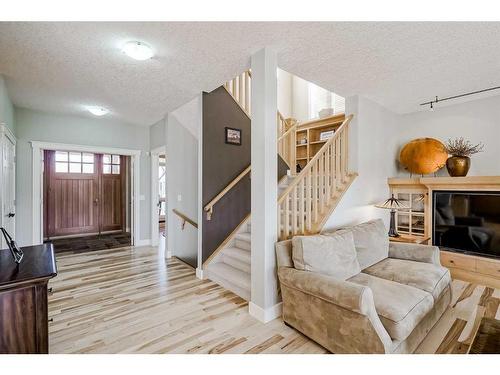 73 Tusslewood Heights Nw, Calgary, AB - Indoor Photo Showing Other Room With Fireplace