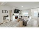 255 Creekstone Way Sw, Calgary, AB  - Indoor Photo Showing Living Room With Fireplace 