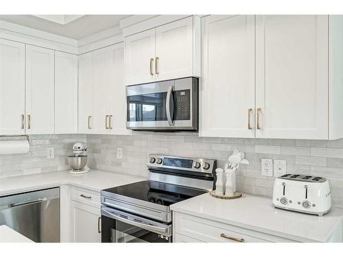 255 Creekstone Way Sw, Calgary, AB - Indoor Photo Showing Kitchen With Upgraded Kitchen