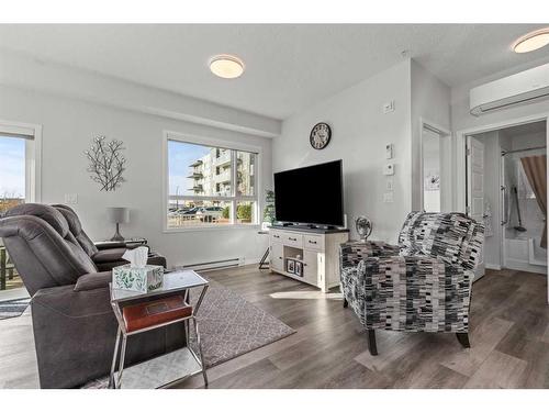 116-80 Carrington Plaza Nw, Calgary, AB - Indoor Photo Showing Living Room