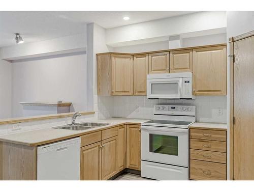 2358-151 Country Village Road Ne, Calgary, AB - Indoor Photo Showing Kitchen With Double Sink