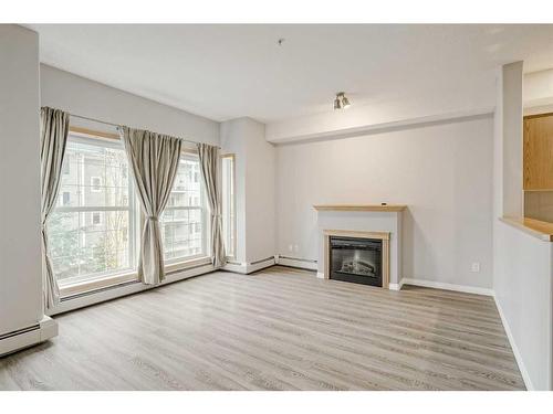 2358-151 Country Village Road Ne, Calgary, AB - Indoor Photo Showing Living Room With Fireplace