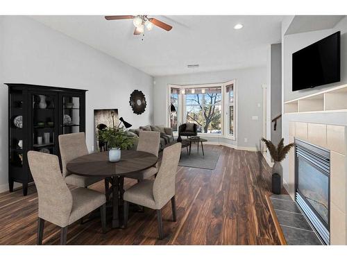 47 West Springs Lane Sw, Calgary, AB - Indoor Photo Showing Dining Room With Fireplace