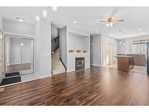 47 West Springs Lane Sw, Calgary, AB - Indoor Photo Showing Living Room With Fireplace