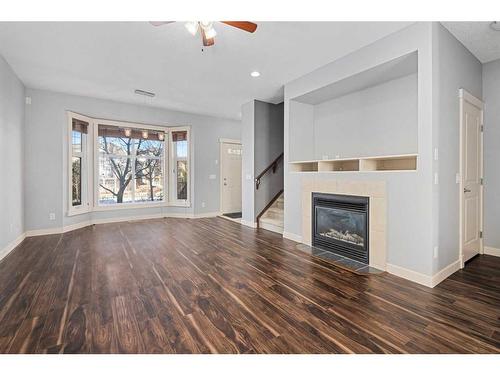 47 West Springs Lane Sw, Calgary, AB - Indoor Photo Showing Living Room With Fireplace