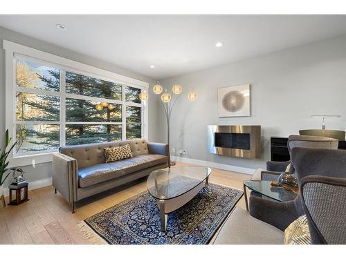 728 36 Street Nw, Calgary, AB - Indoor Photo Showing Living Room With Fireplace