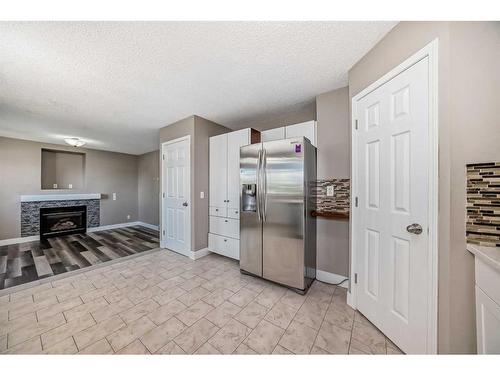 27 Canoe Circle Sw, Airdrie, AB - Indoor With Fireplace