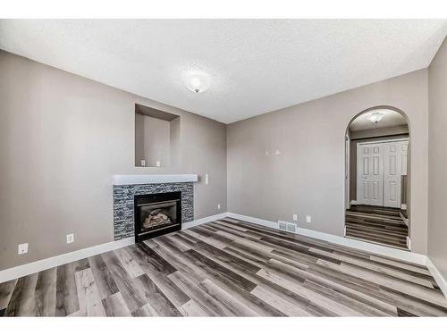 27 Canoe Circle Sw, Airdrie, AB - Indoor With Fireplace