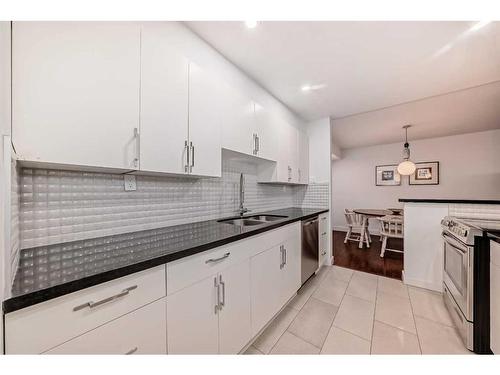 4B-133 25 Avenue Sw, Calgary, AB - Indoor Photo Showing Kitchen With Double Sink With Upgraded Kitchen