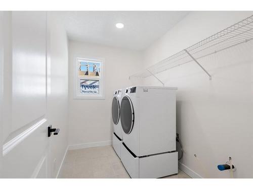 53 Versant Point Sw, Calgary, AB - Indoor Photo Showing Laundry Room