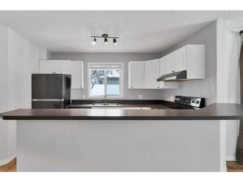 3102-20 Harvest Rose Park Ne, Calgary, AB - Indoor Photo Showing Kitchen With Double Sink