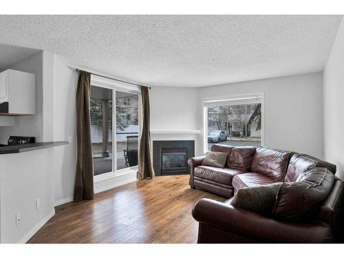 3102-20 Harvest Rose Park Ne, Calgary, AB - Indoor Photo Showing Living Room With Fireplace