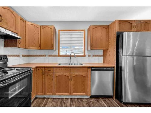 104 Taracove Crescent Ne, Calgary, AB - Indoor Photo Showing Kitchen With Double Sink