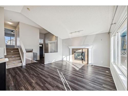 154 Prestwick Landing Se, Calgary, AB - Indoor Photo Showing Other Room With Fireplace