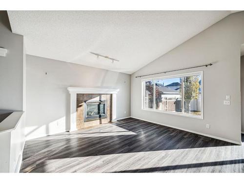 154 Prestwick Landing Se, Calgary, AB - Indoor Photo Showing Living Room With Fireplace