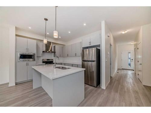 660 South Point Heath Sw, Airdrie, AB - Indoor Photo Showing Kitchen With Stainless Steel Kitchen With Double Sink With Upgraded Kitchen