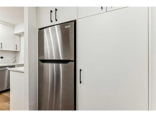 1101-2520 Palliser Drive Sw, Calgary, AB - Indoor Photo Showing Kitchen With Stainless Steel Kitchen