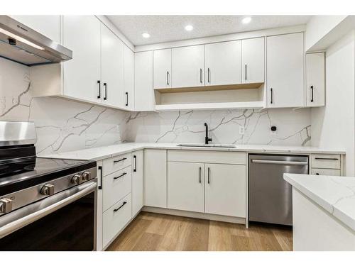 1101-2520 Palliser Drive Sw, Calgary, AB - Indoor Photo Showing Kitchen With Stainless Steel Kitchen With Upgraded Kitchen